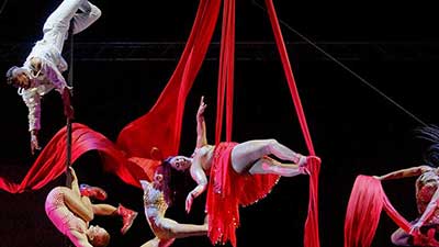 Aerial performers suspended from ribbons