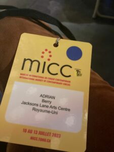 A delegate name badge from micc. It reads: Adrian Berry Jacksons Lane Arts Centre Royaume Uni